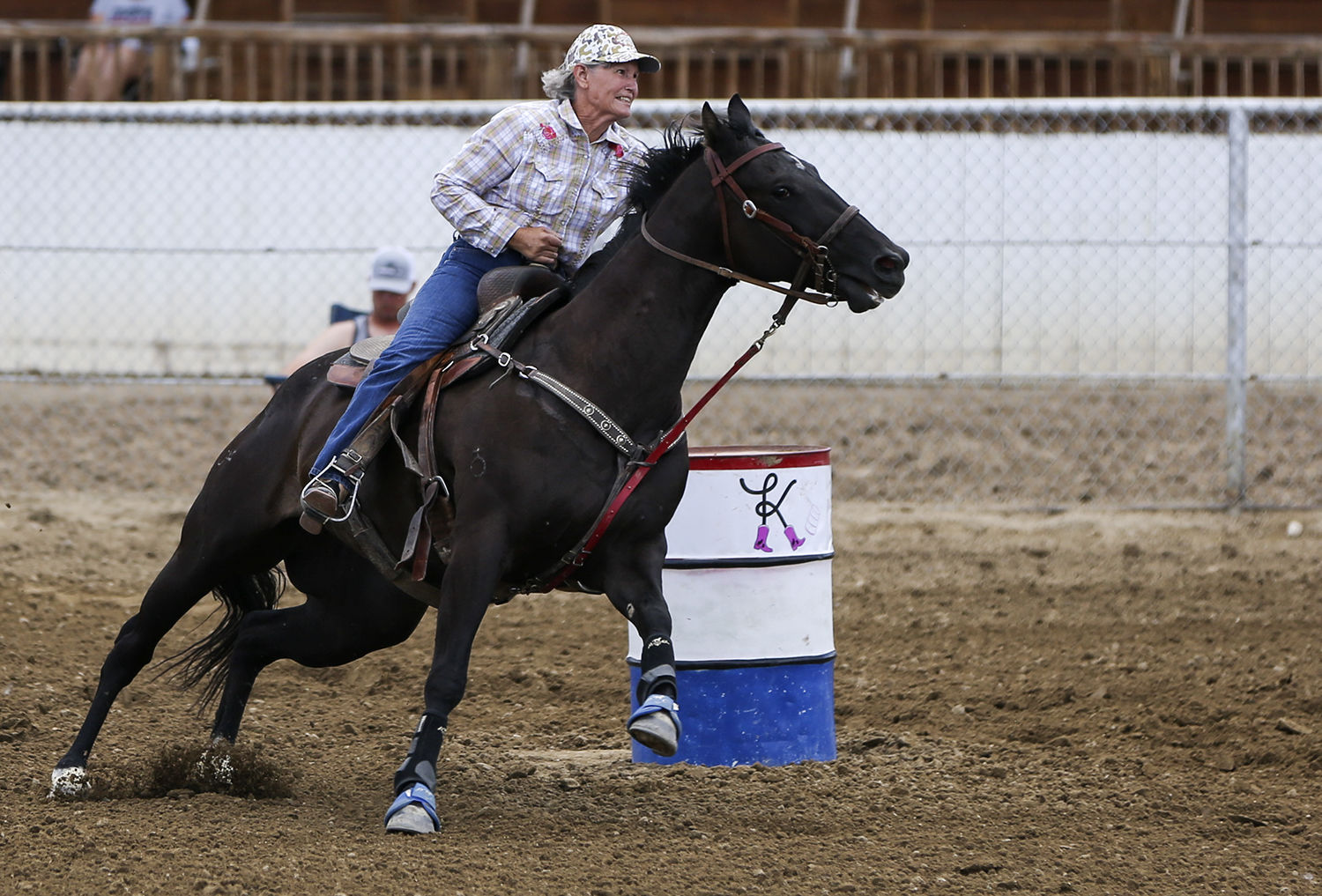Sue Jarrard turns around the second barrel and looks for the third